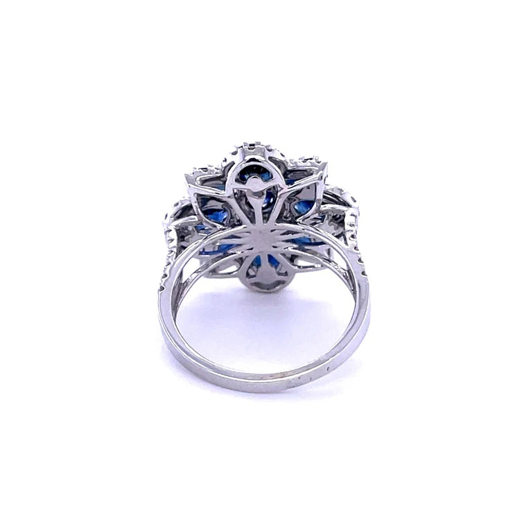 14KT WHITE GOLD BLUE SAPPHIRE FLOWER WITH DIAMONDS RING