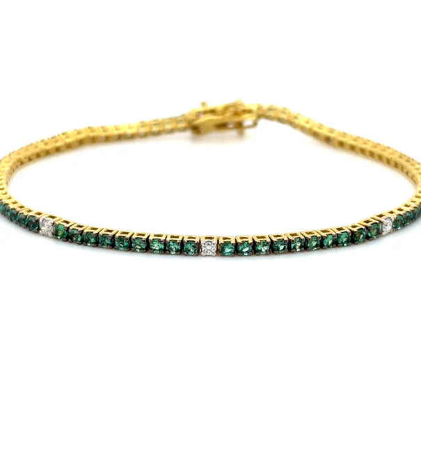 18K YELLOW GOLD EMERALD AND DIAMOND TENNIS BRACELET