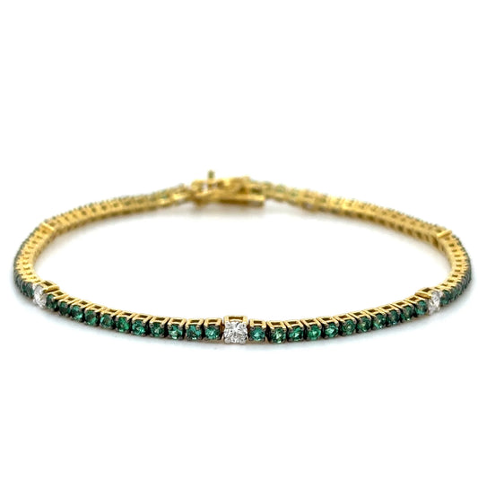 18K YELLOW GOLD EMERALD AND DIAMOND TENNIS BRACELET