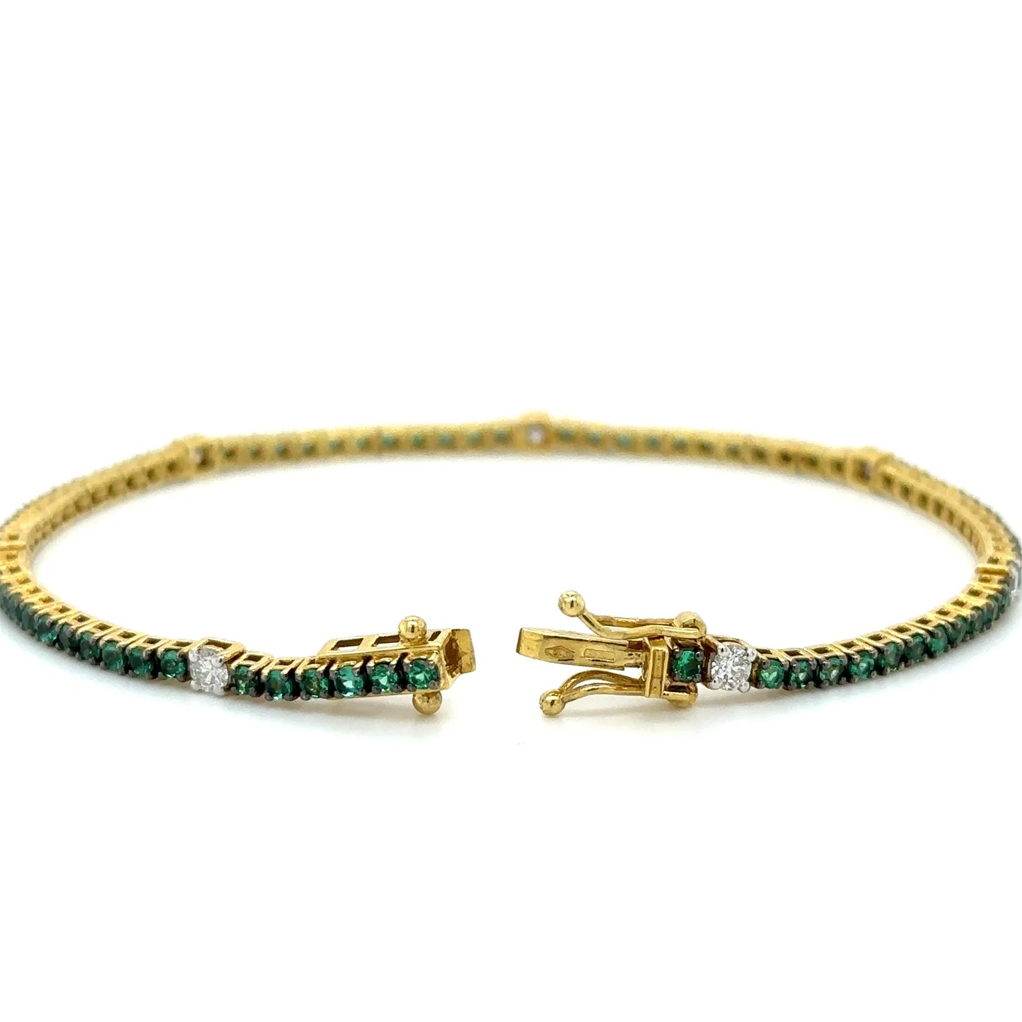 18K YELLOW GOLD EMERALD AND DIAMOND TENNIS BRACELET