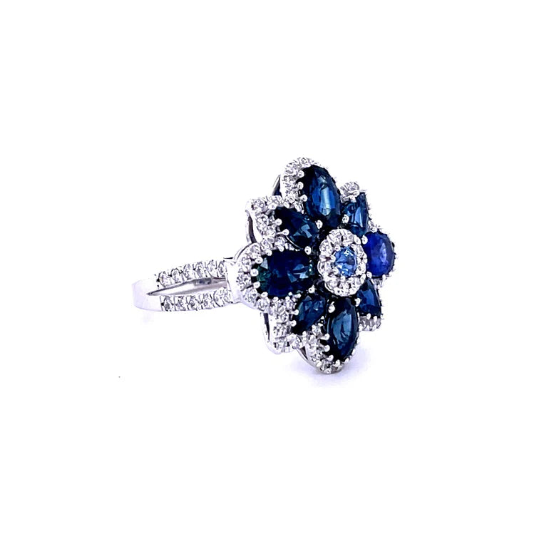 14KT WHITE GOLD BLUE SAPPHIRE FLOWER WITH DIAMONDS RING